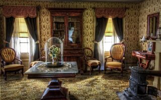 Hoe richt je een woonkamer in met vintage meubels?