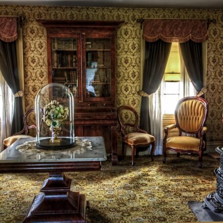 Hoe richt je een woonkamer in met vintage meubels?